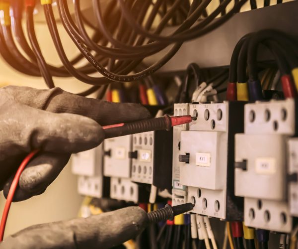 Electrical,Engineer,Using,Digital,Multi-meter,Measuring,Equipment,To,Checking,Electric